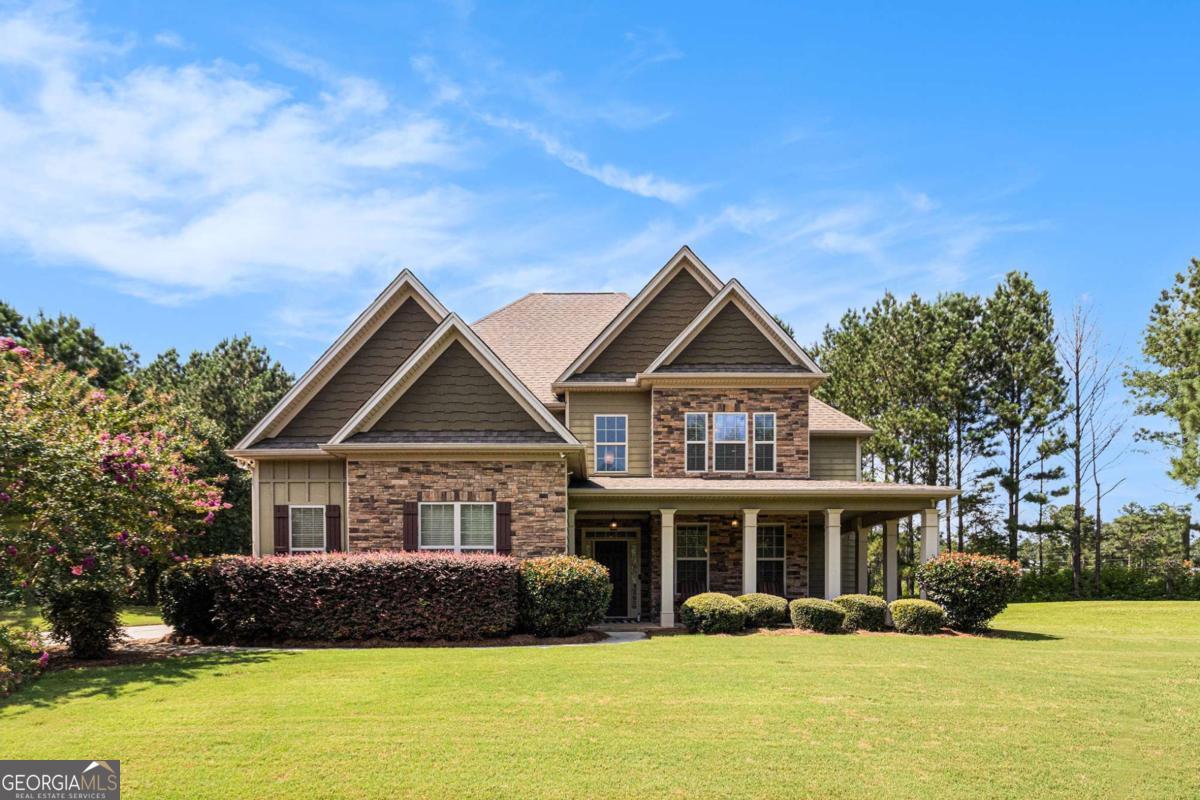 466 Austin Storey Circle Newnan, GA 30263 - Photo 29 of 39 a front view of a house with a yard