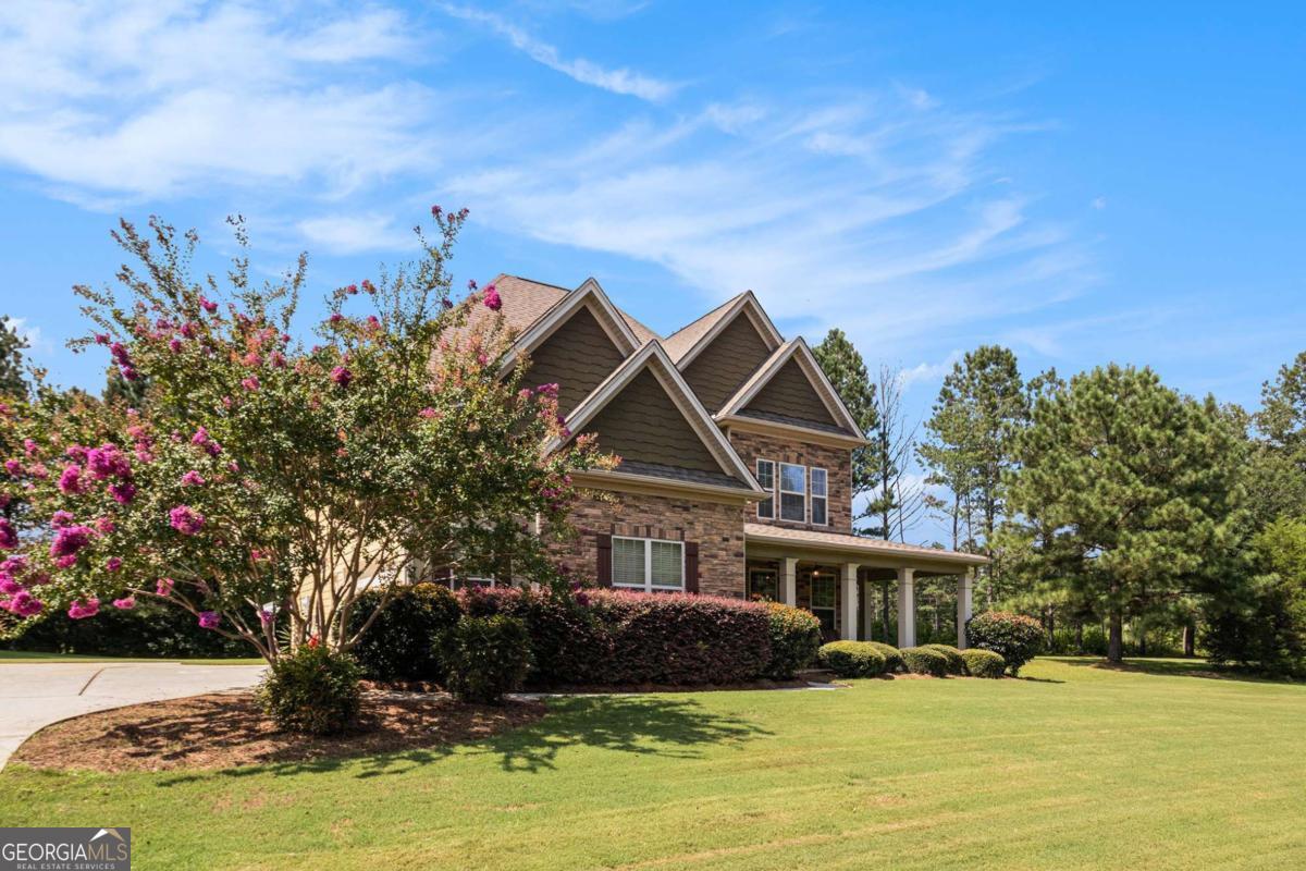 466 Austin Storey Circle Newnan, GA 30263 - Photo 30 of 39 a front view of a house with a yard
