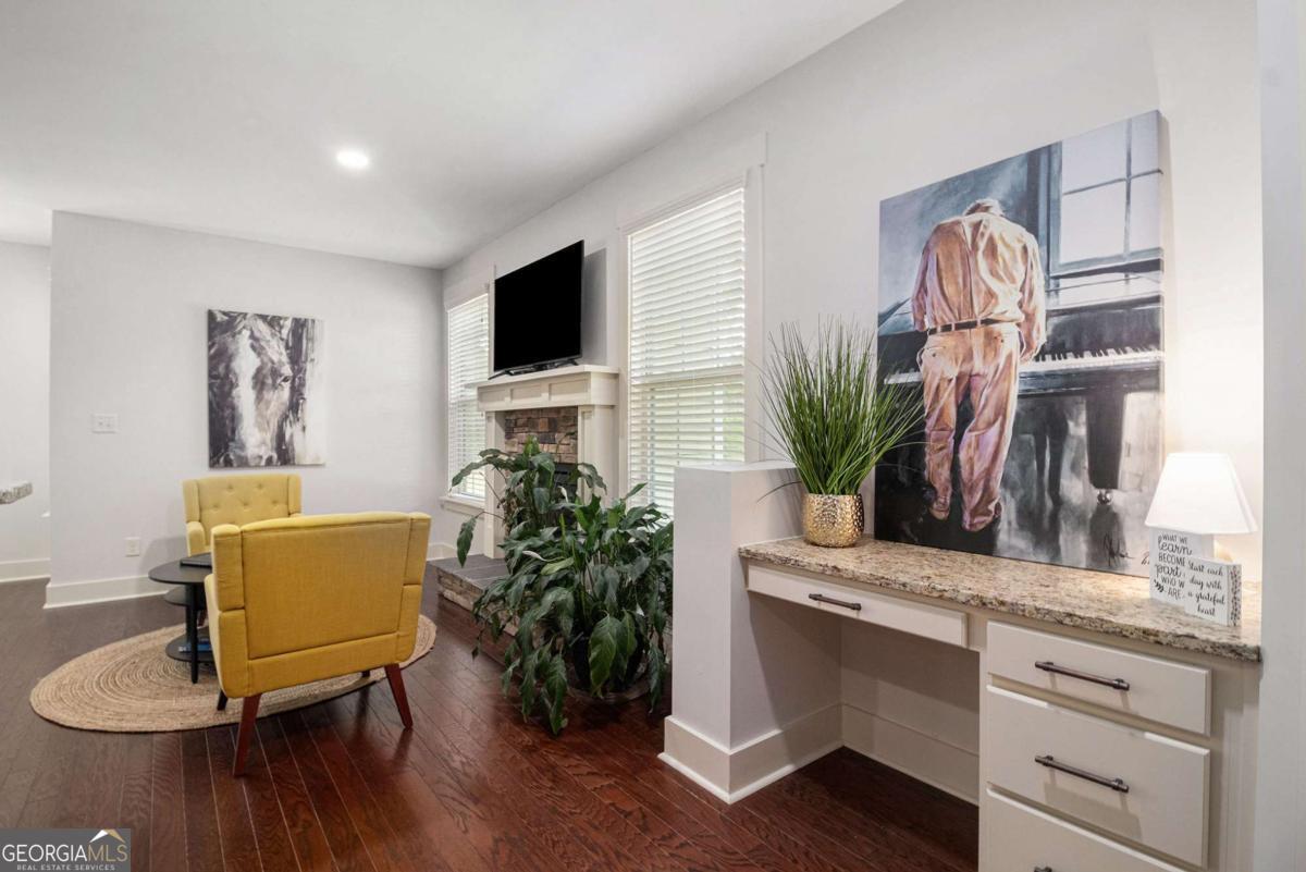 466 Austin Storey Circle Newnan, GA 30263 - Photo 8 of 39 a living room with furniture and a potted plant