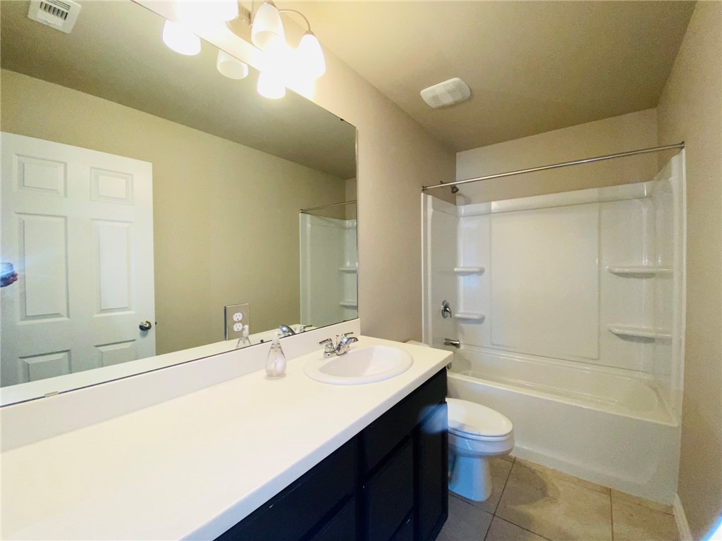 2270 Tallow Drive Portland, TX 78374 - Photo 25 of 38 a bathroom with a sink a toilet and shower