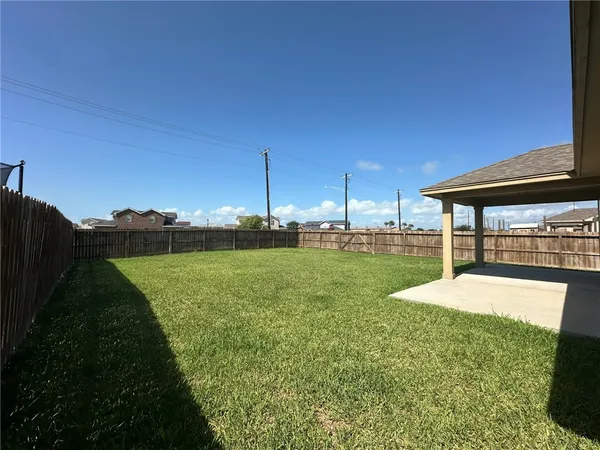 a view of a backyard with sitting area
