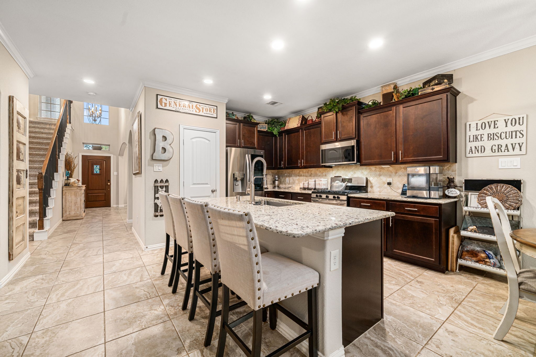 931 South Chamfer Way Crosby, TX 77532 - Photo 20 of 40 a kitchen with stainless steel appliances granite countertop a refrigerator and a stove top oven