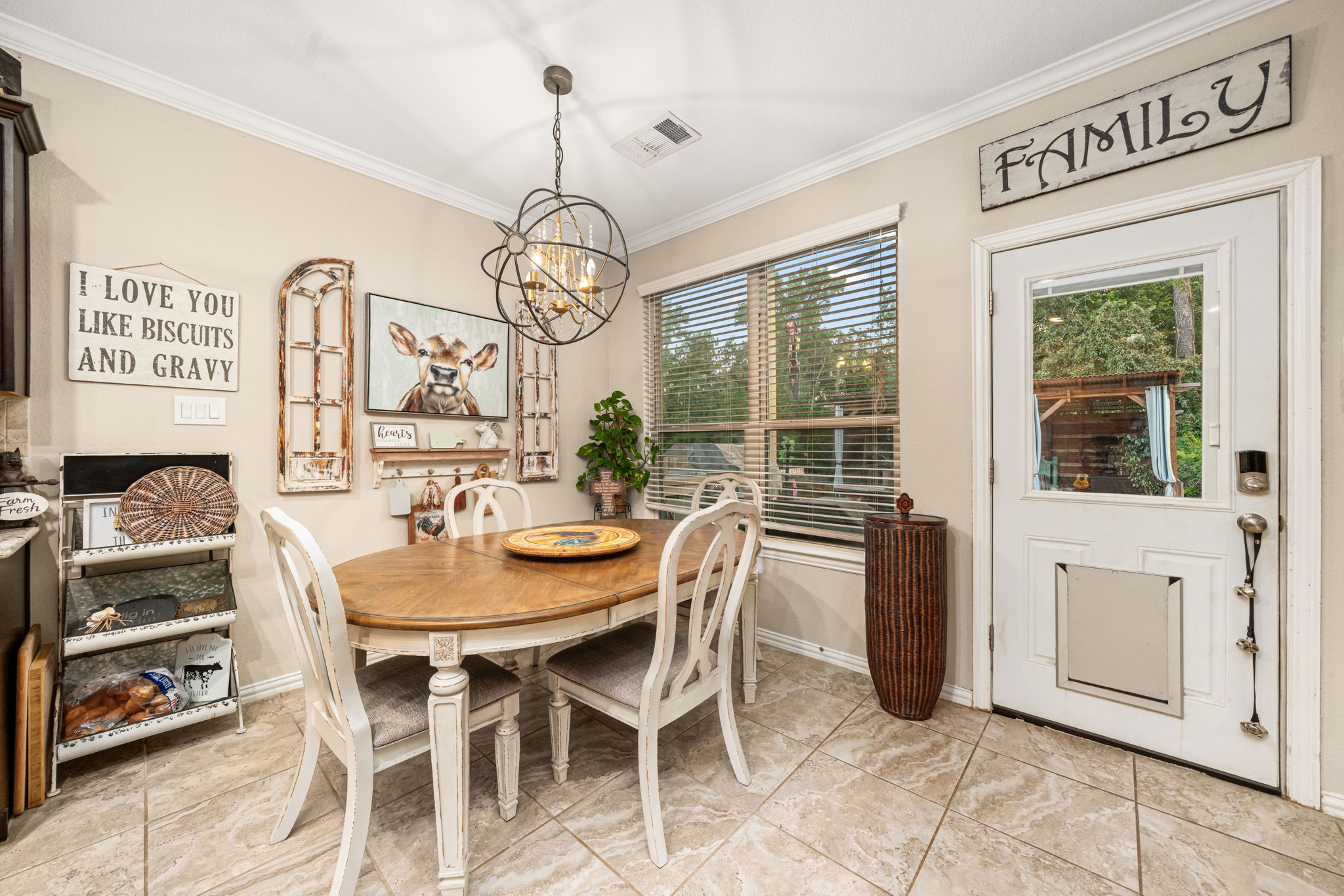 931 South Chamfer Way Crosby, TX 77532 - Photo 23 of 40 a view of a dining room with furniture wooden floor and chandelier
