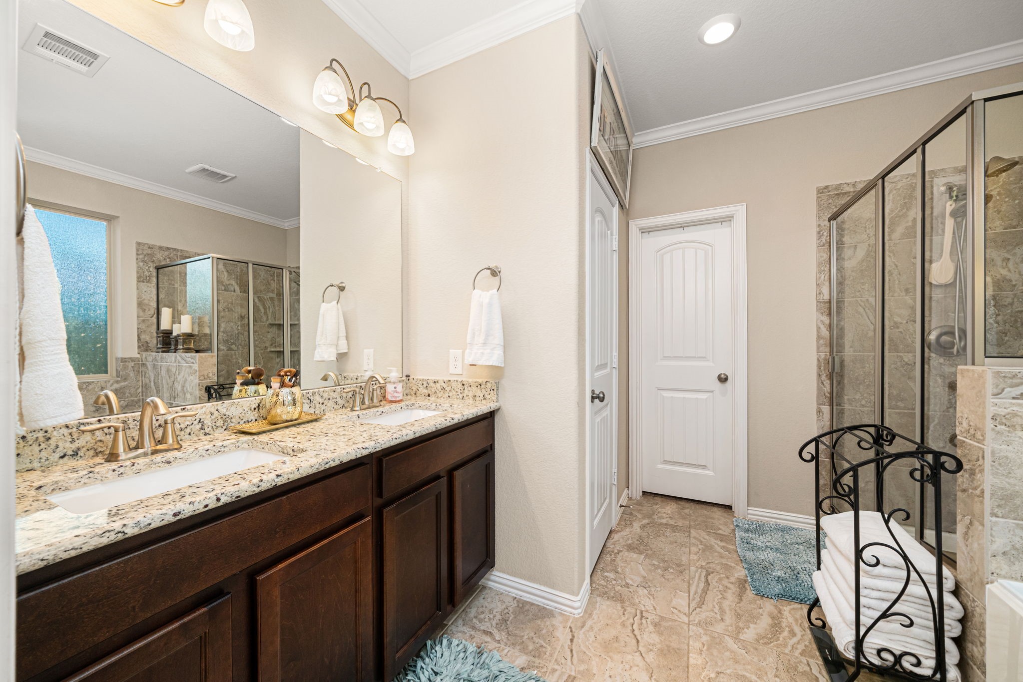 931 South Chamfer Way Crosby, TX 77532 - Photo 29 of 40 a bathroom with a granite countertop sink a mirror and a shower