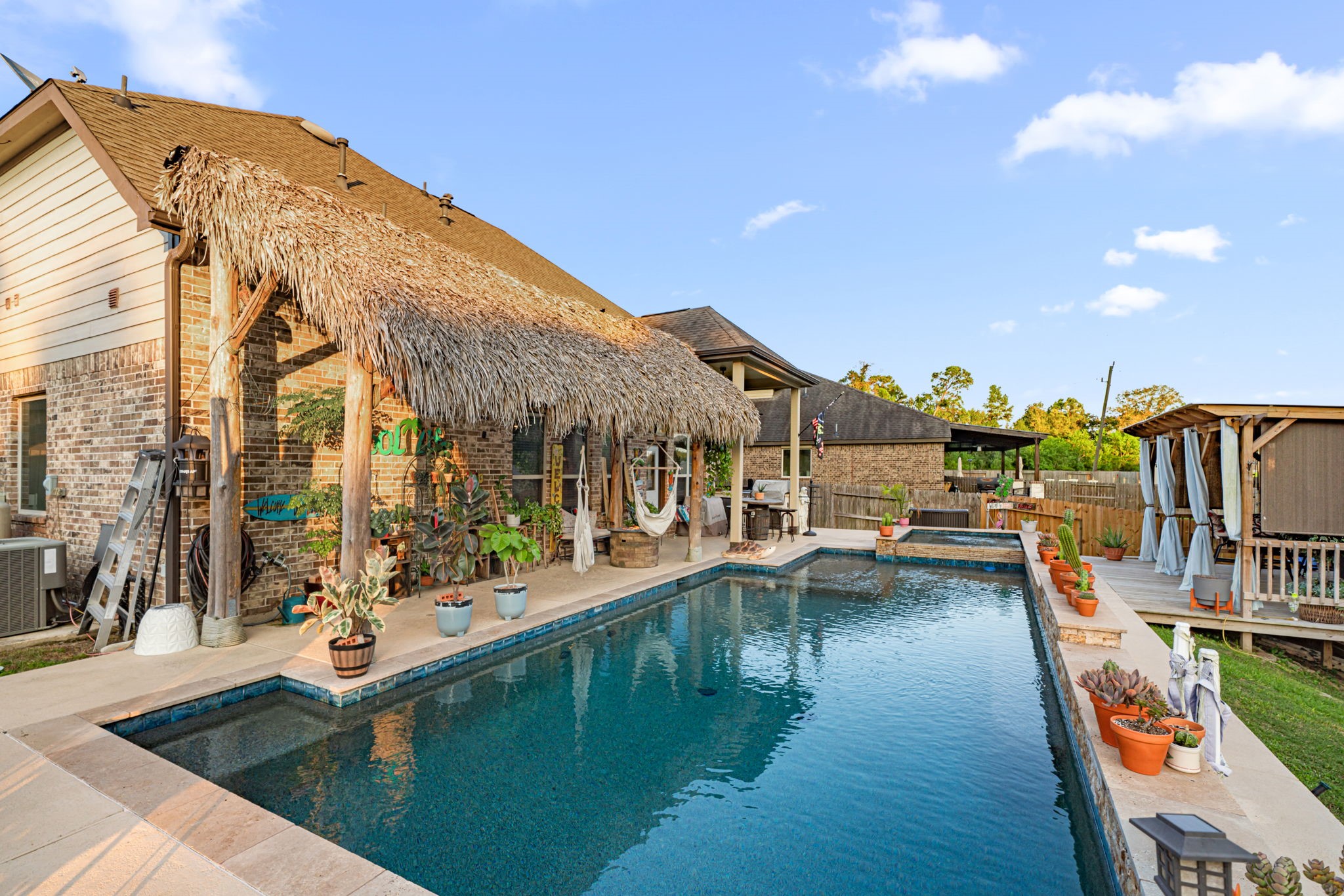 931 South Chamfer Way Crosby, TX 77532 - Photo 9 of 40 a view of a swimming pool with a lounge chairs