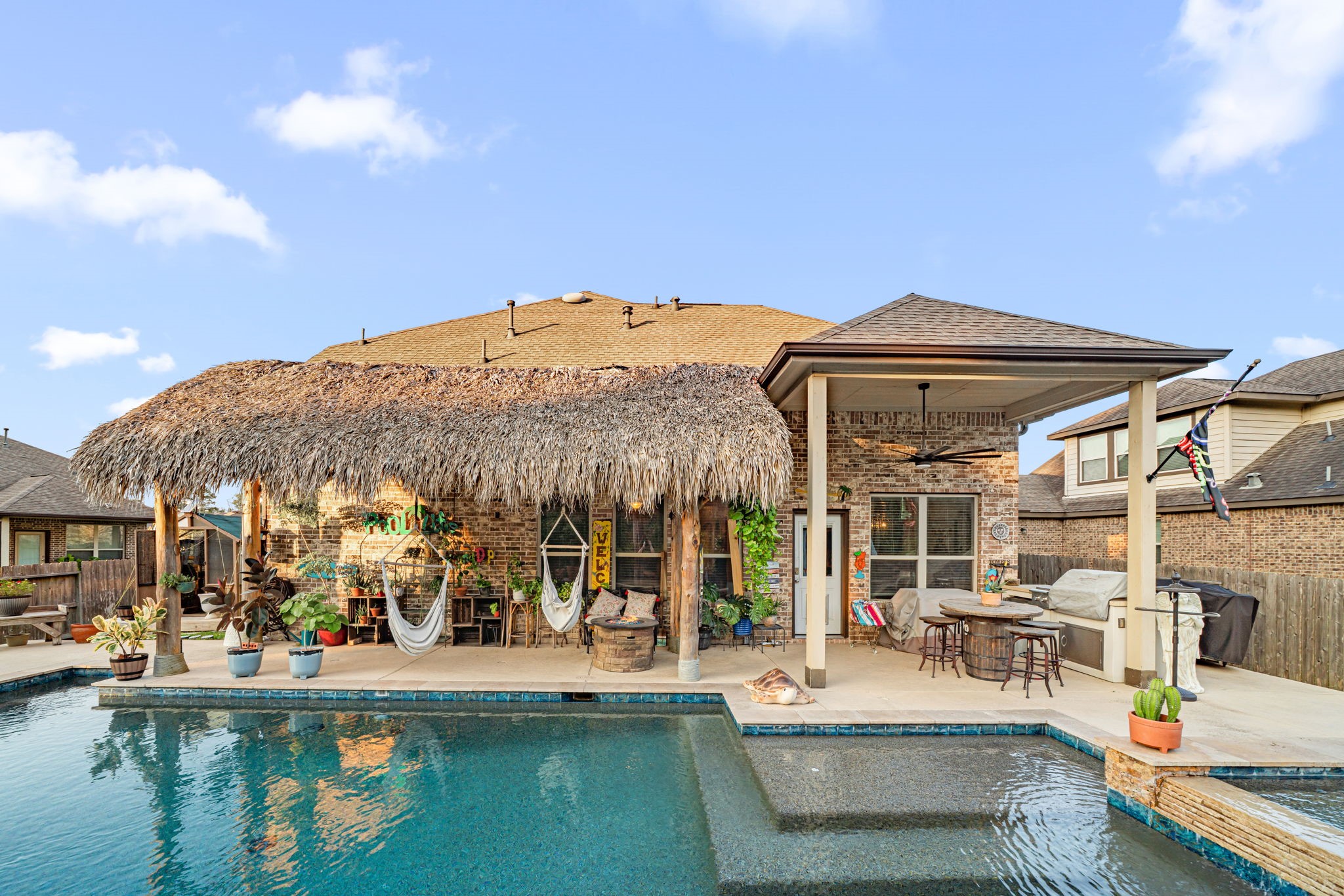 931 South Chamfer Way Crosby, TX 77532 - Photo 10 of 40 a view of a building with a swimming pool and sitting area
