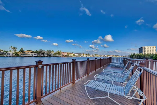a view of a dining table and chairs in the patio