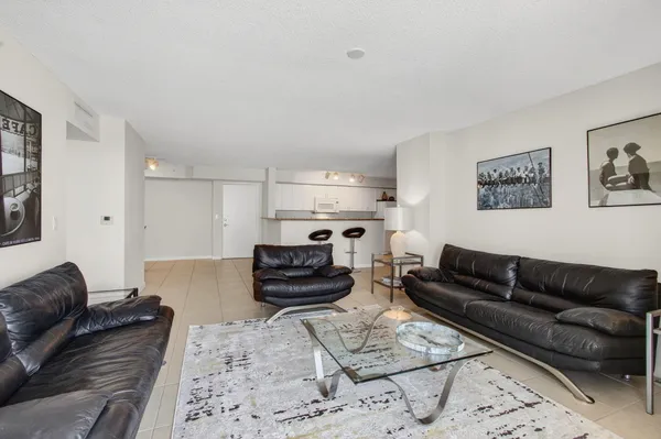 a living room with furniture a rug and a couch