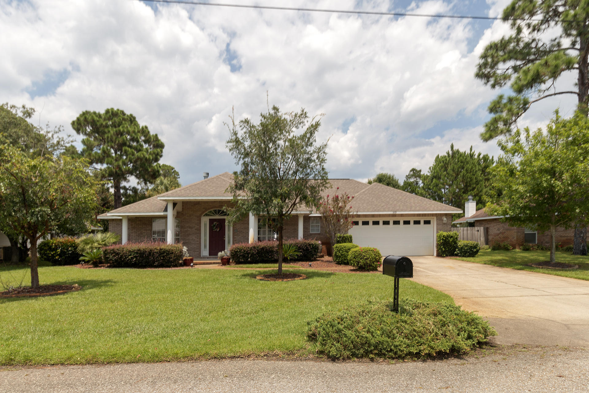 160 Pritchard Road Miramar Beach, FL 32550 - Photo 1 of 36 a front view of a house with garden