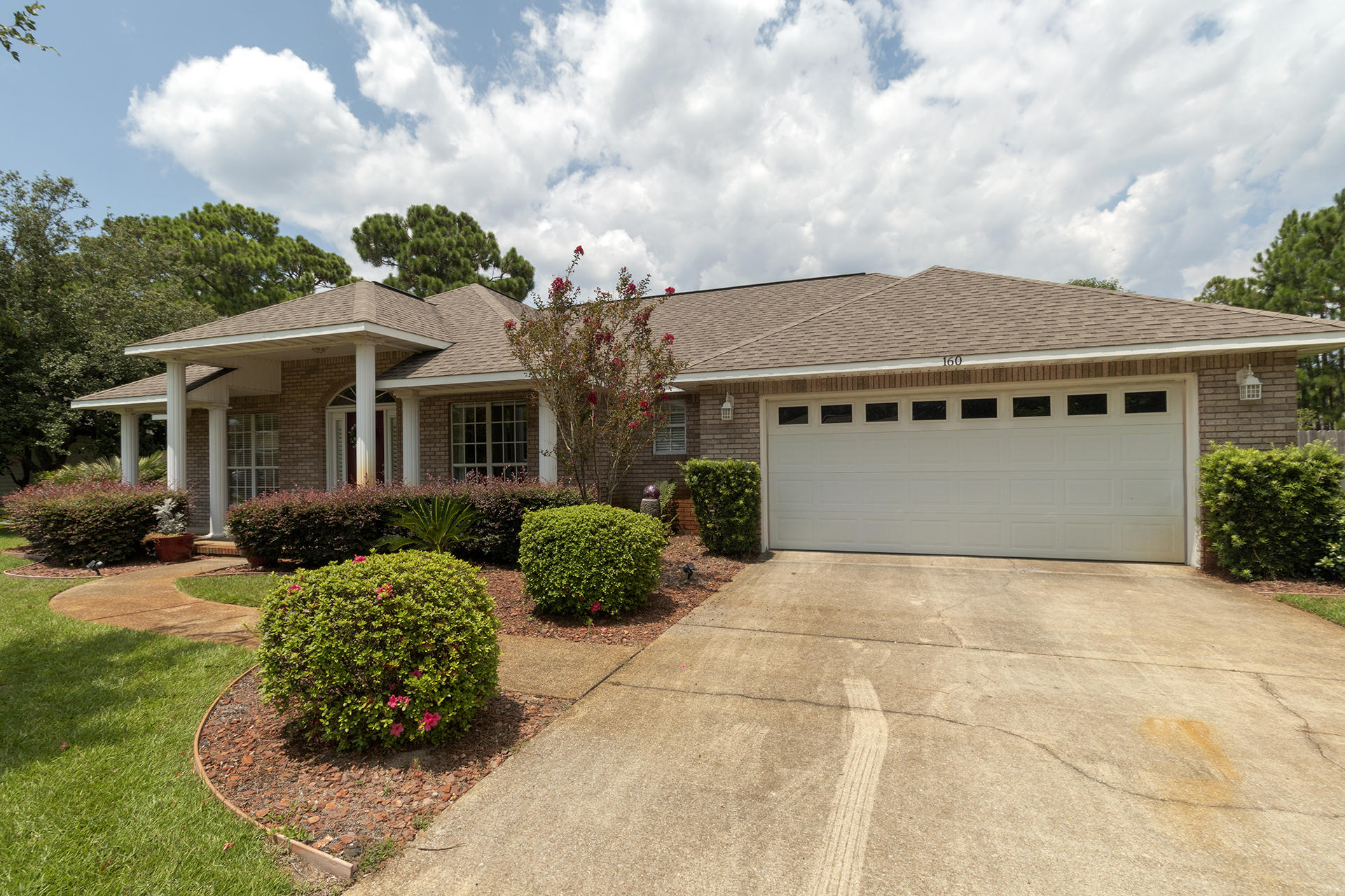 160 Pritchard Road Miramar Beach, FL 32550 - Photo 2 of 36 a front view of a house with garden