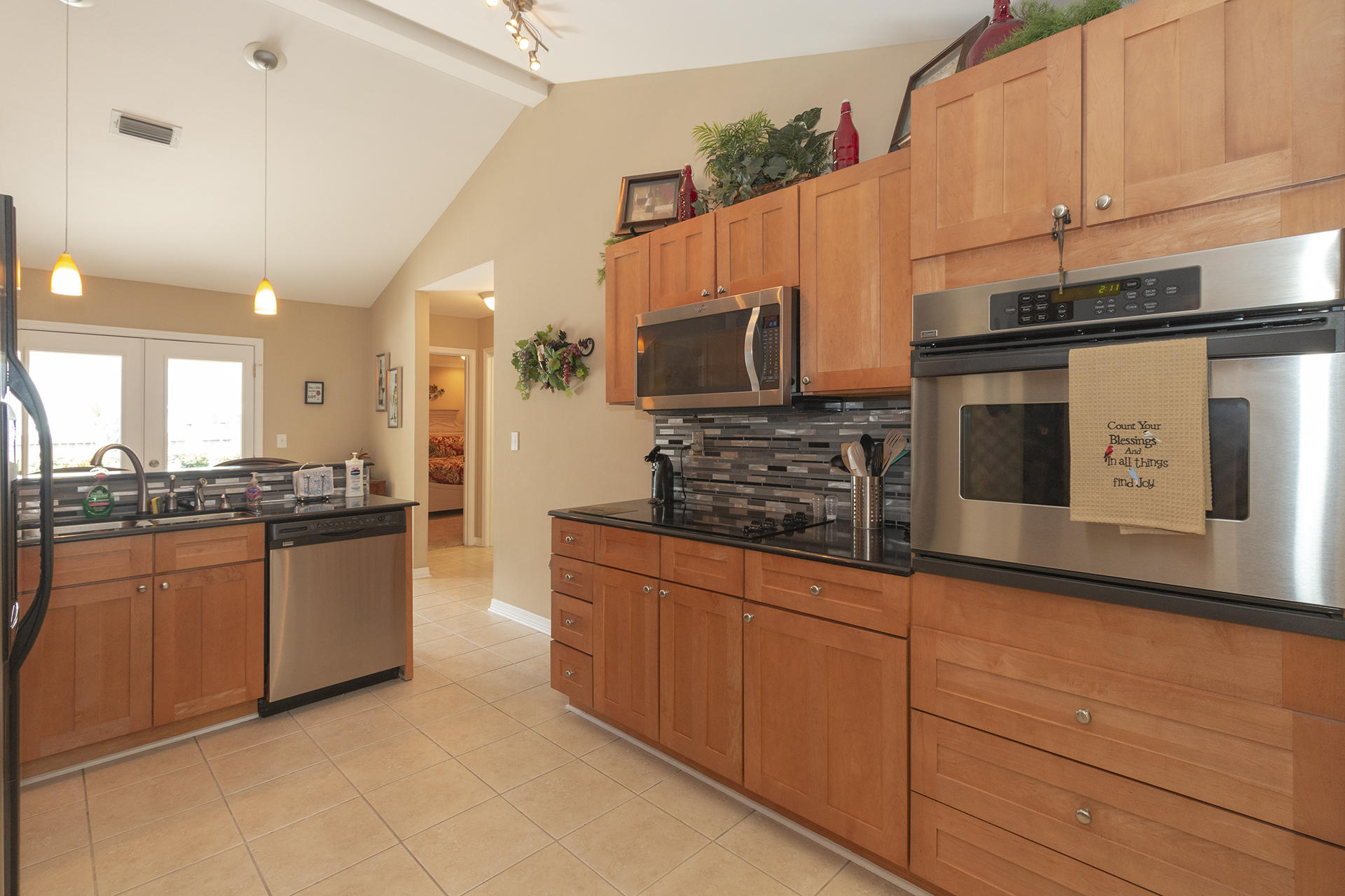 160 Pritchard Road Miramar Beach, FL 32550 - Photo 12 of 36 a kitchen with stainless steel appliances granite countertop a stove and a microwave