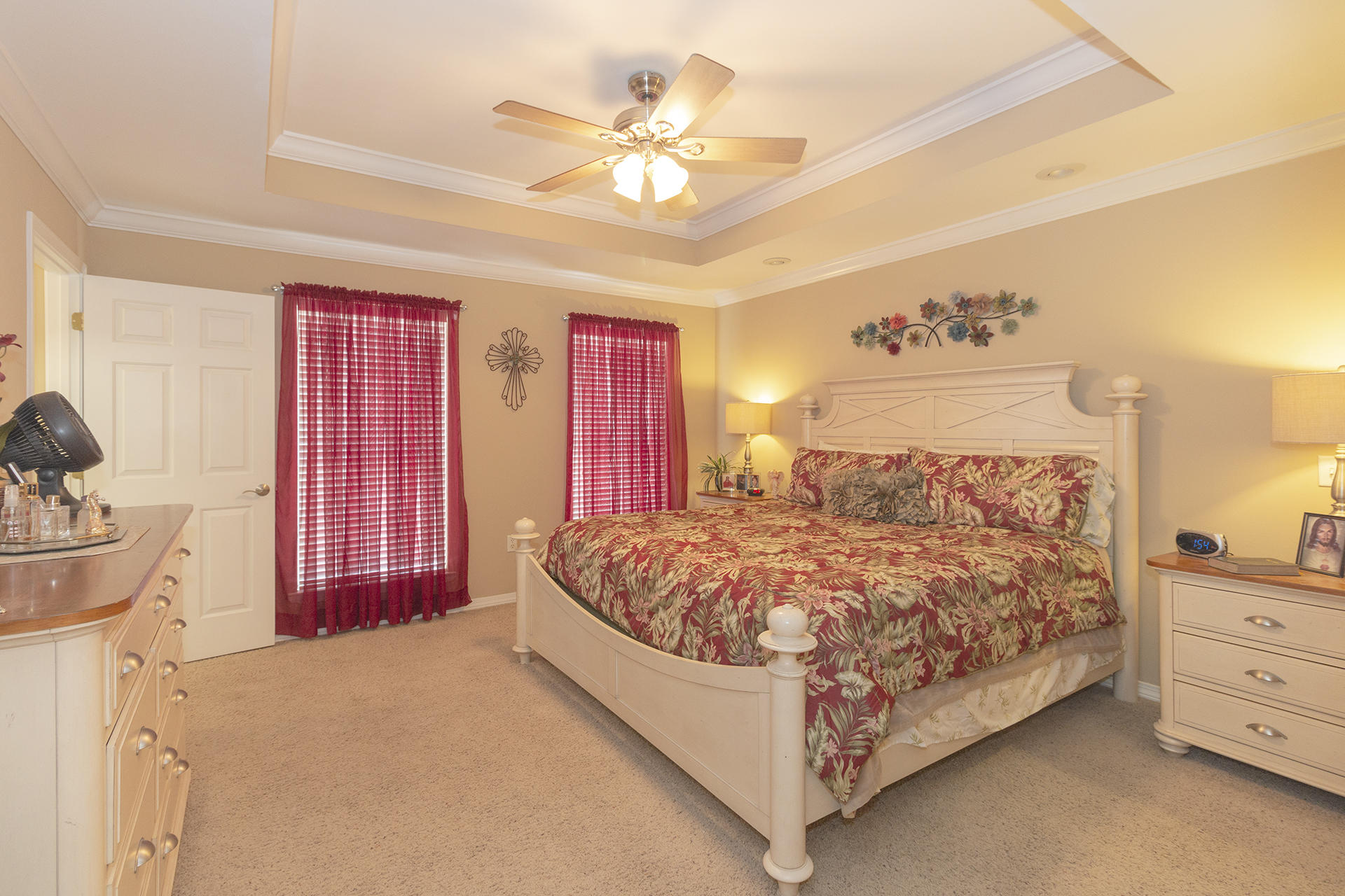 160 Pritchard Road Miramar Beach, FL 32550 - Photo 18 of 36 a bed sitting in a bedroom next to a window and a chandelier
