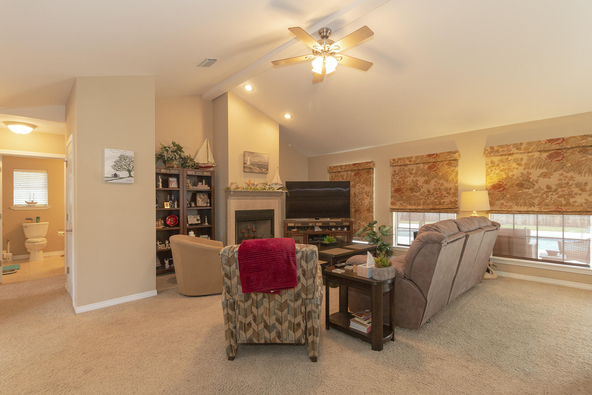 160 Pritchard Road Miramar Beach, FL 32550 - Photo 5 of 36 a living room with furniture a fireplace and a flat screen tv