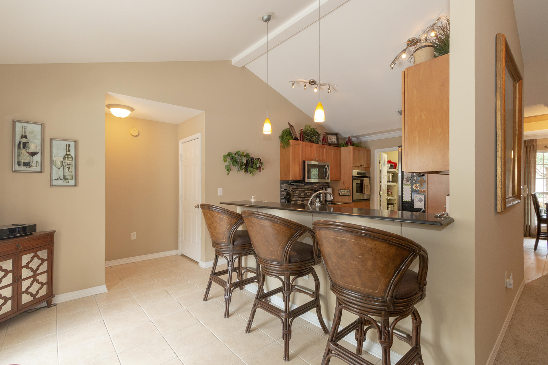 160 Pritchard Road Miramar Beach, FL 32550 - Photo 7 of 36 a dining hall with stainless steel appliances granite countertop a table and chairs