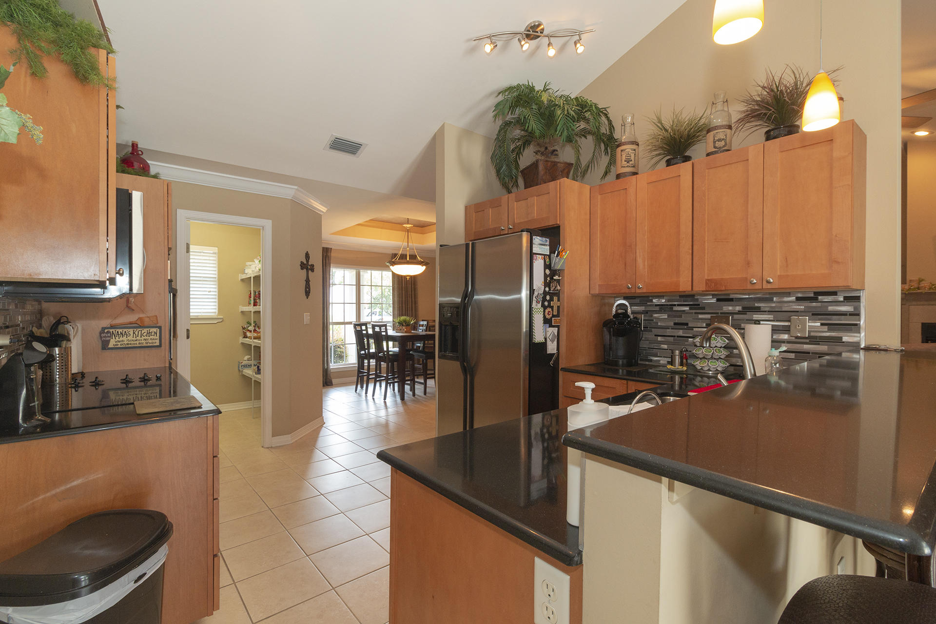 160 Pritchard Road Miramar Beach, FL 32550 - Photo 9 of 36 a kitchen with stainless steel appliances granite countertop a sink a stove and a refrigerator