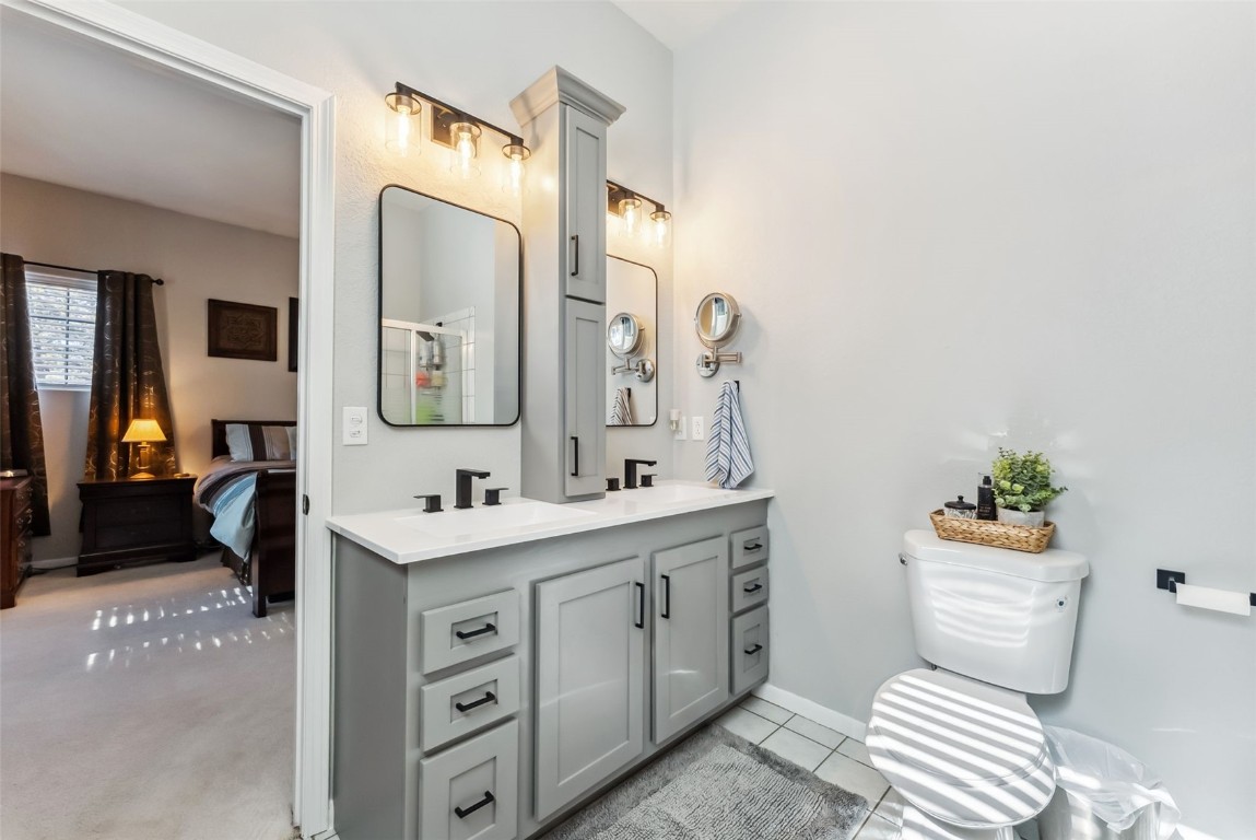 109 Old Corral Road Bailey, CO 80421 - Photo 29 of 50 a bathroom with a sink toilet and mirror