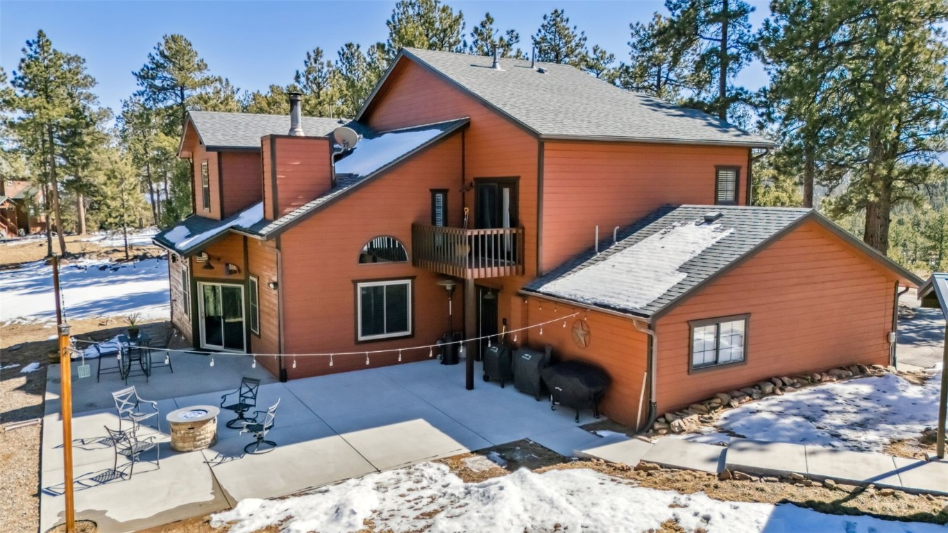109 Old Corral Road Bailey, CO 80421 - Photo 43 of 50 a view of a house with a yard