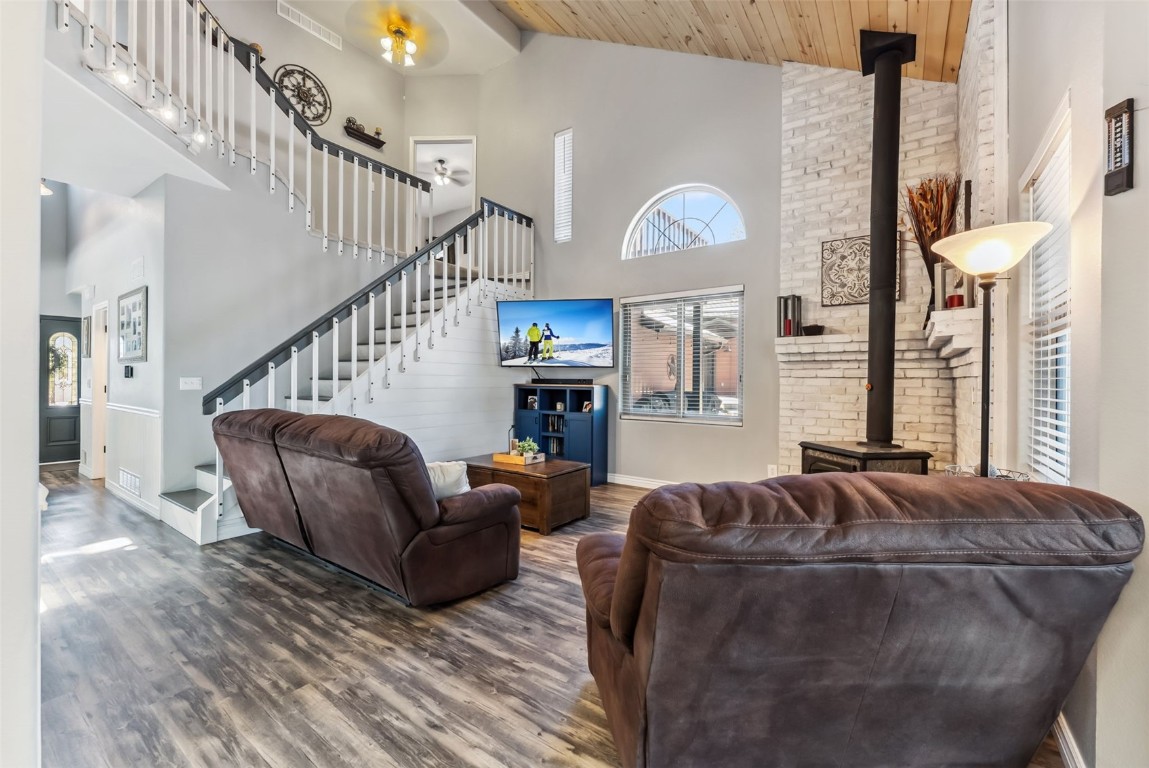109 Old Corral Road Bailey, CO 80421 - Photo 5 of 50 a living room with furniture and a fireplace