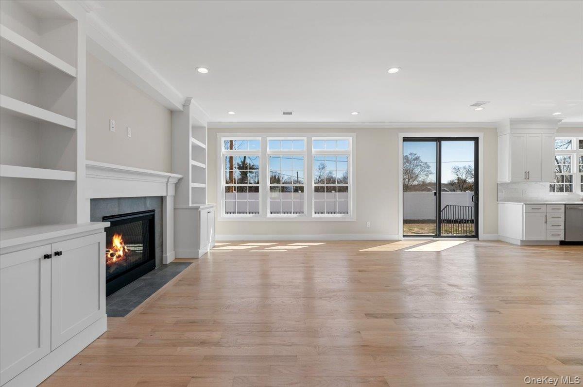 32 Sherman Road Old Bethpage, NY 11804 - Photo 10 of 45 Sliders to Yard, Custom Cabinets, and Gas Fireplace