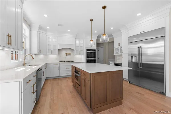 a kitchen with a sink and a stove top oven