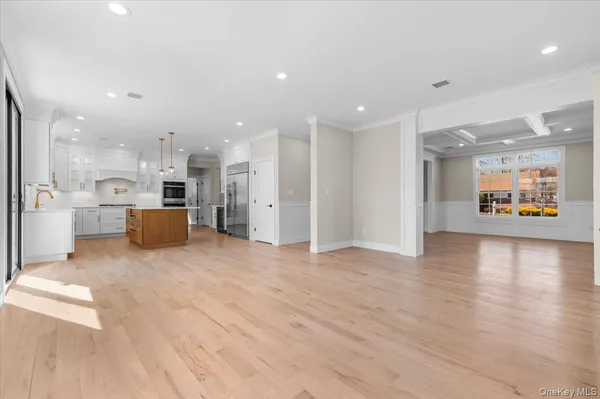 a kitchen with a stove a sink a refrigerator and a center island