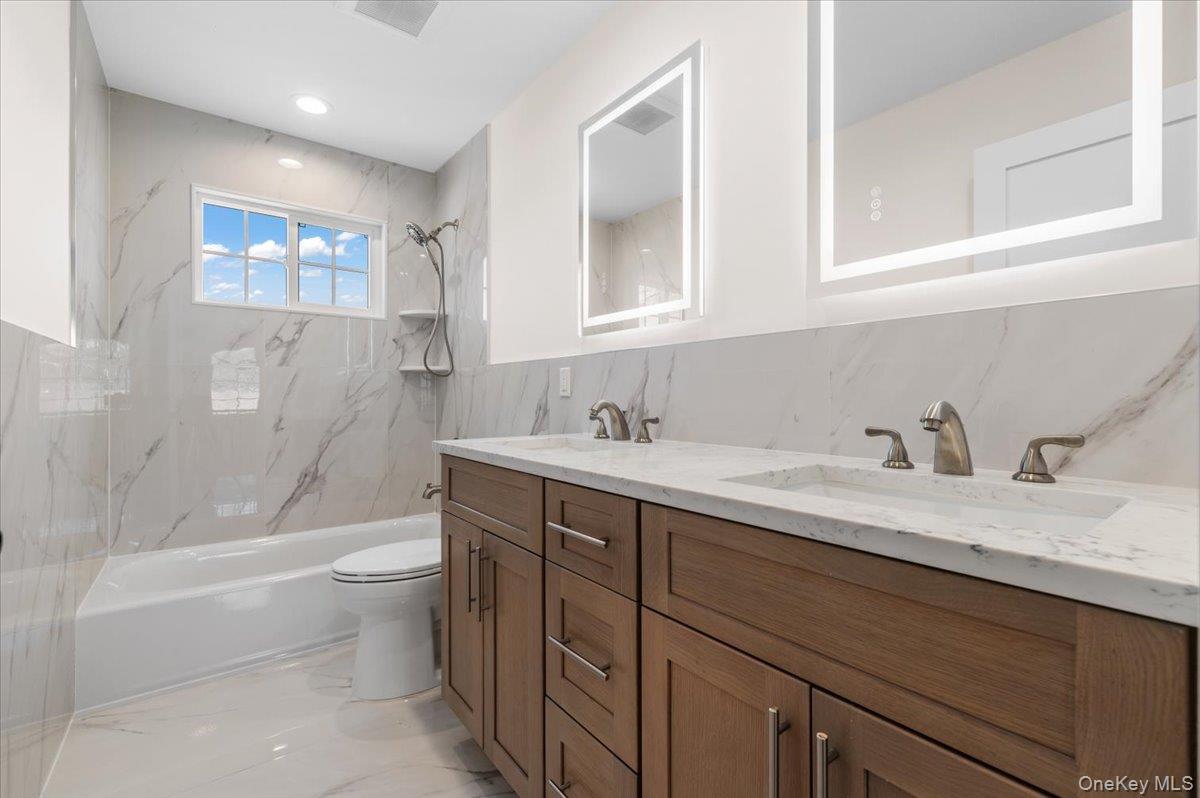 32 Sherman Road Old Bethpage, NY 11804 - Photo 31 of 45 Second Floor Bath with Double Sinks and Tub