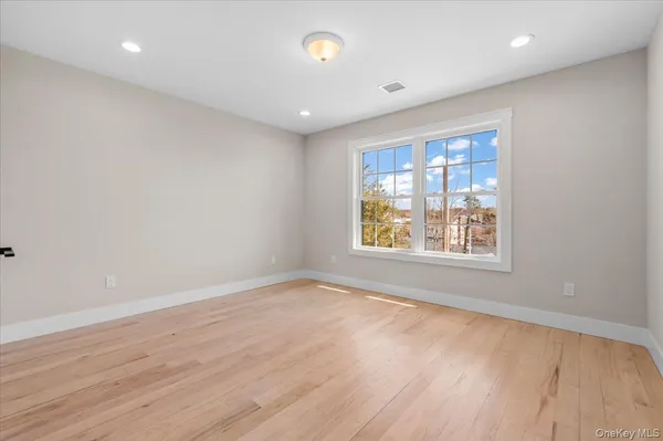 a spacious bathroom with a granite countertop sink toilet and shower