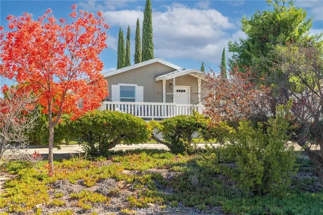 a house with a tree in front of it