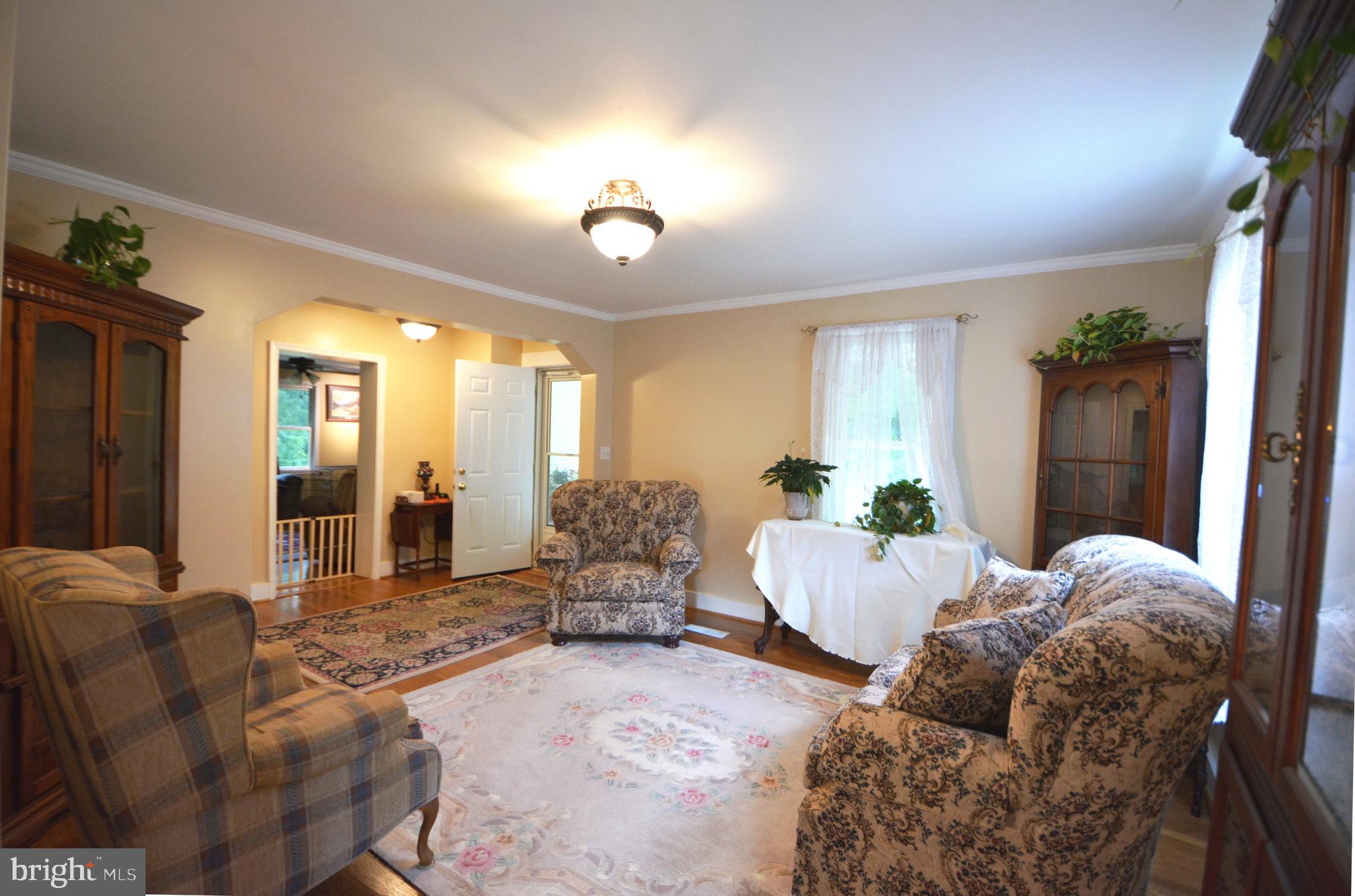 2165 Woodview Road Finksburg, MD 21048 - Photo 18 of 70 Living room is 13 x 13 foot w/ crown molding