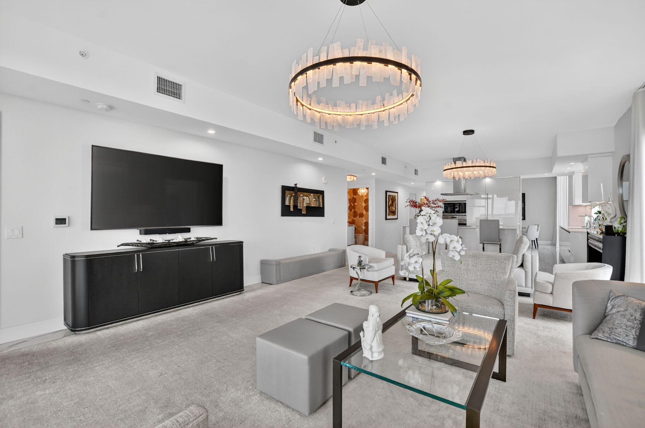 20155 Boca W Drive, Unit B701 Boca Raton, FL 33434 - Photo 10 of 78 a living room with furniture and a flat screen tv