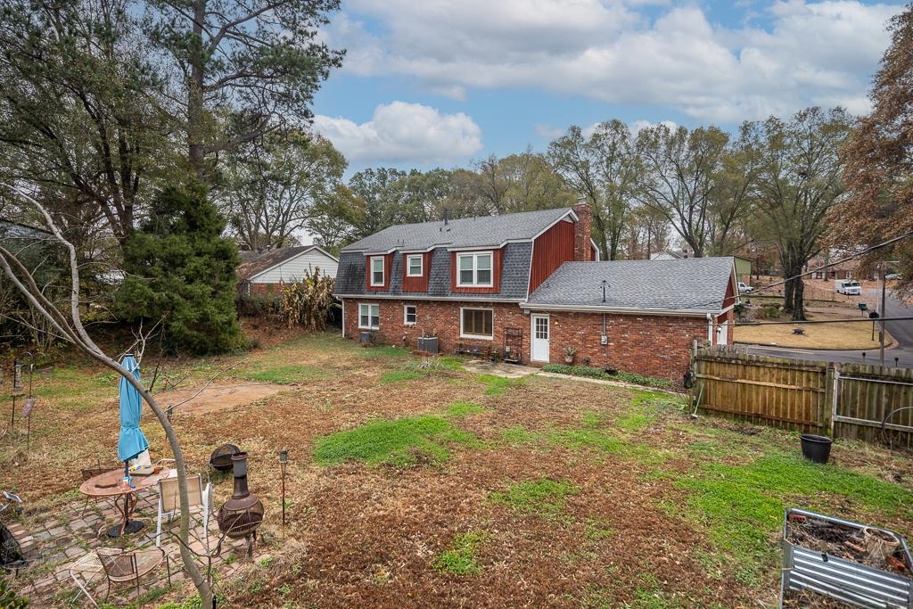 6932 Great Oaks Road Germantown, TN 38138 - Photo 18 of 20 a view of a house with a yard and sitting area