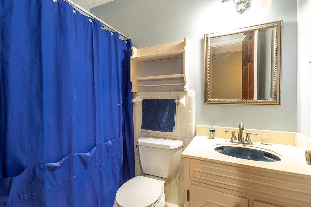 6932 Great Oaks Road Germantown, TN 38138 - Photo 20 of 20 a bathroom with a sink a toilet and shower