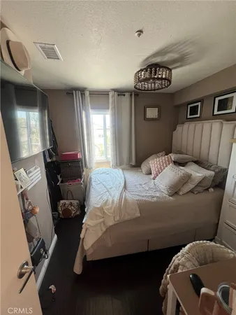 a bedroom with furniture and a window