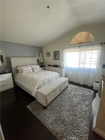 a bedroom with a bed and window