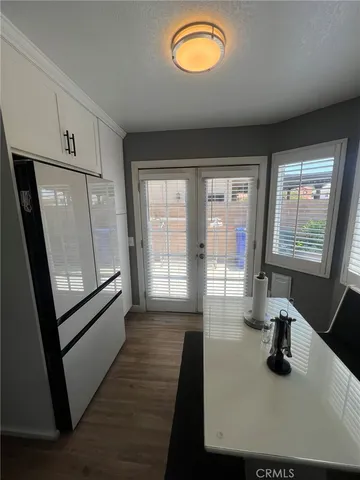 a view of a livingroom with furniture hardwood floor and staircase