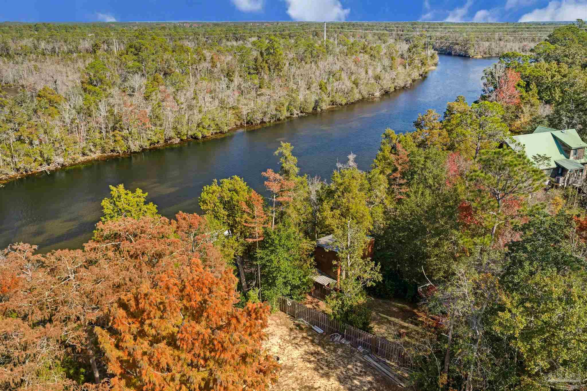 7784 River Road Milton, FL 32583 - Photo 14 of 21 a view of a lake with a mountain view