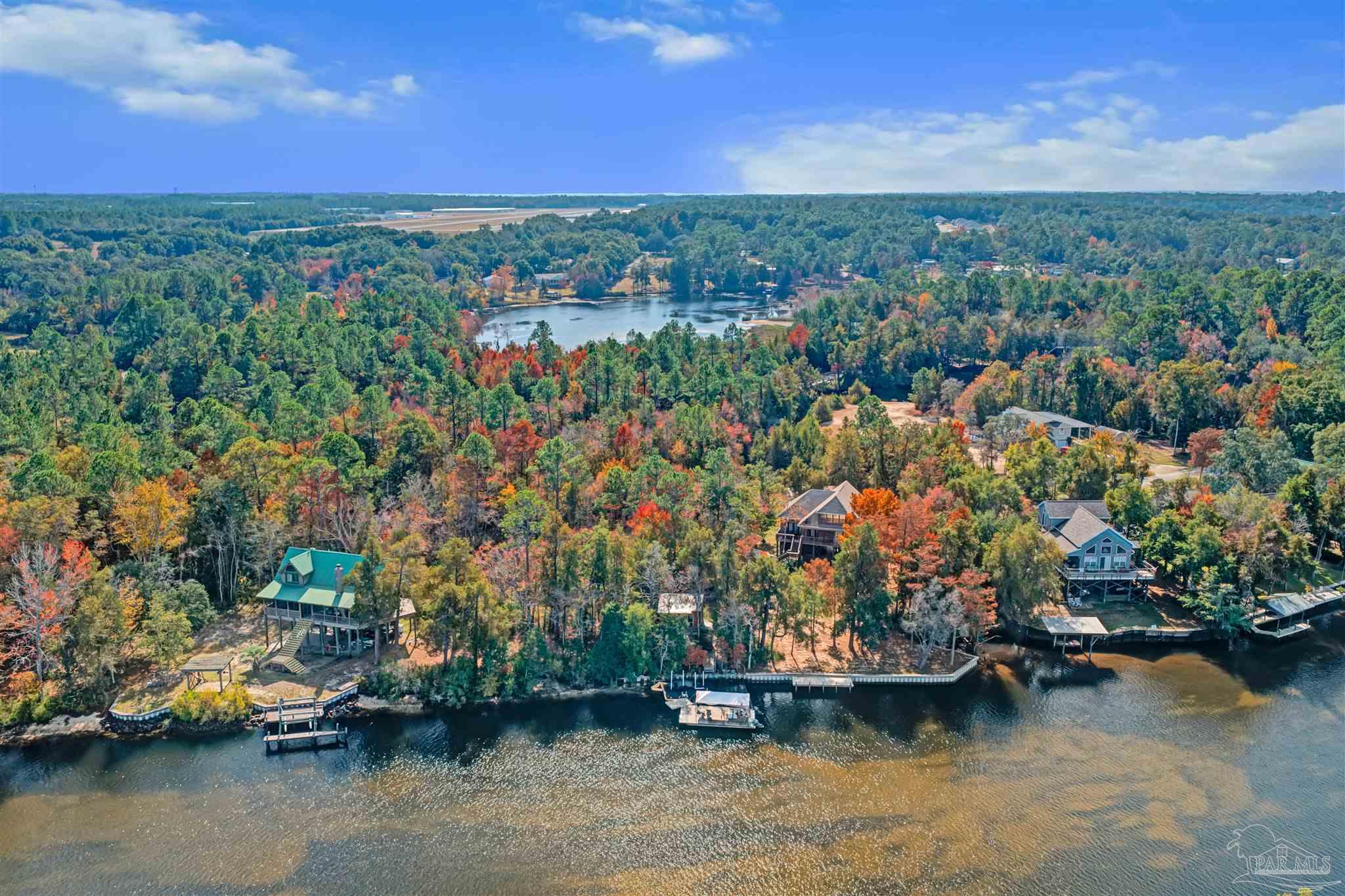 7784 River Road Milton, FL 32583 - Photo 3 of 21 a view of a lake with houses