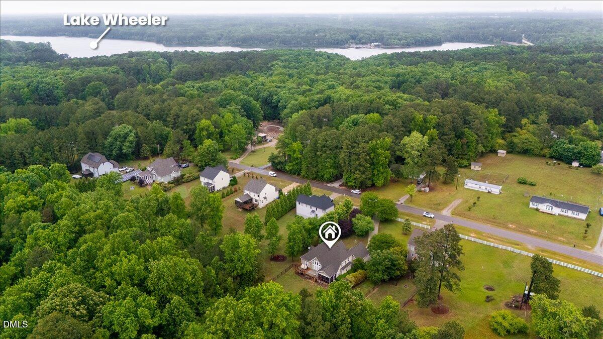 7400 Denlee Road Raleigh, NC 27603 - Photo 45 of 47 an aerial view of lake residential house with outdoor space and trees all around