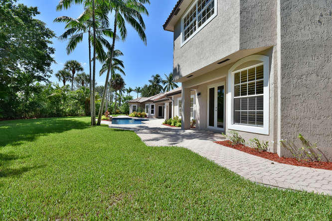 7057 Siena Court Boca Raton, FL 33433 - Photo 48 of 62 Side Lawn & Walk Way