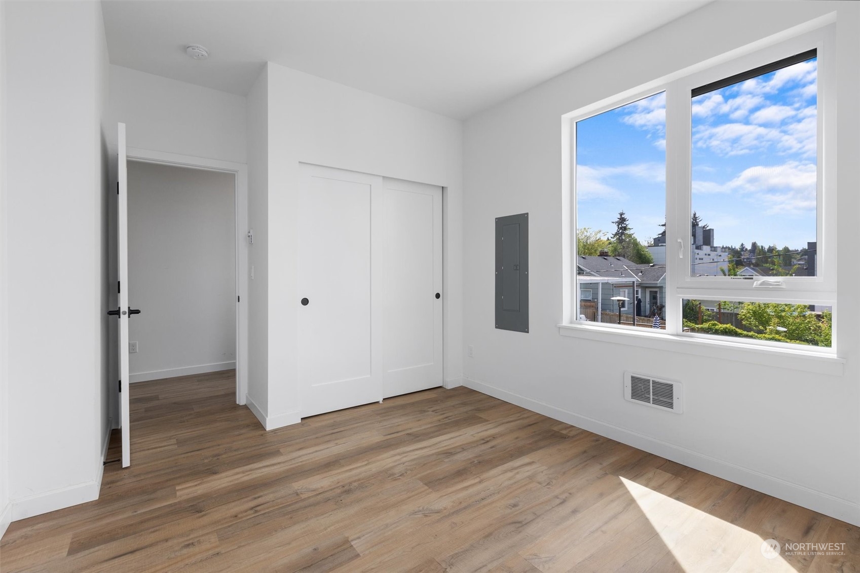 4211 Southwest Raymond Street Seattle, WA 98136 - Photo 11 of 27 wooden floor in an empty room with a window