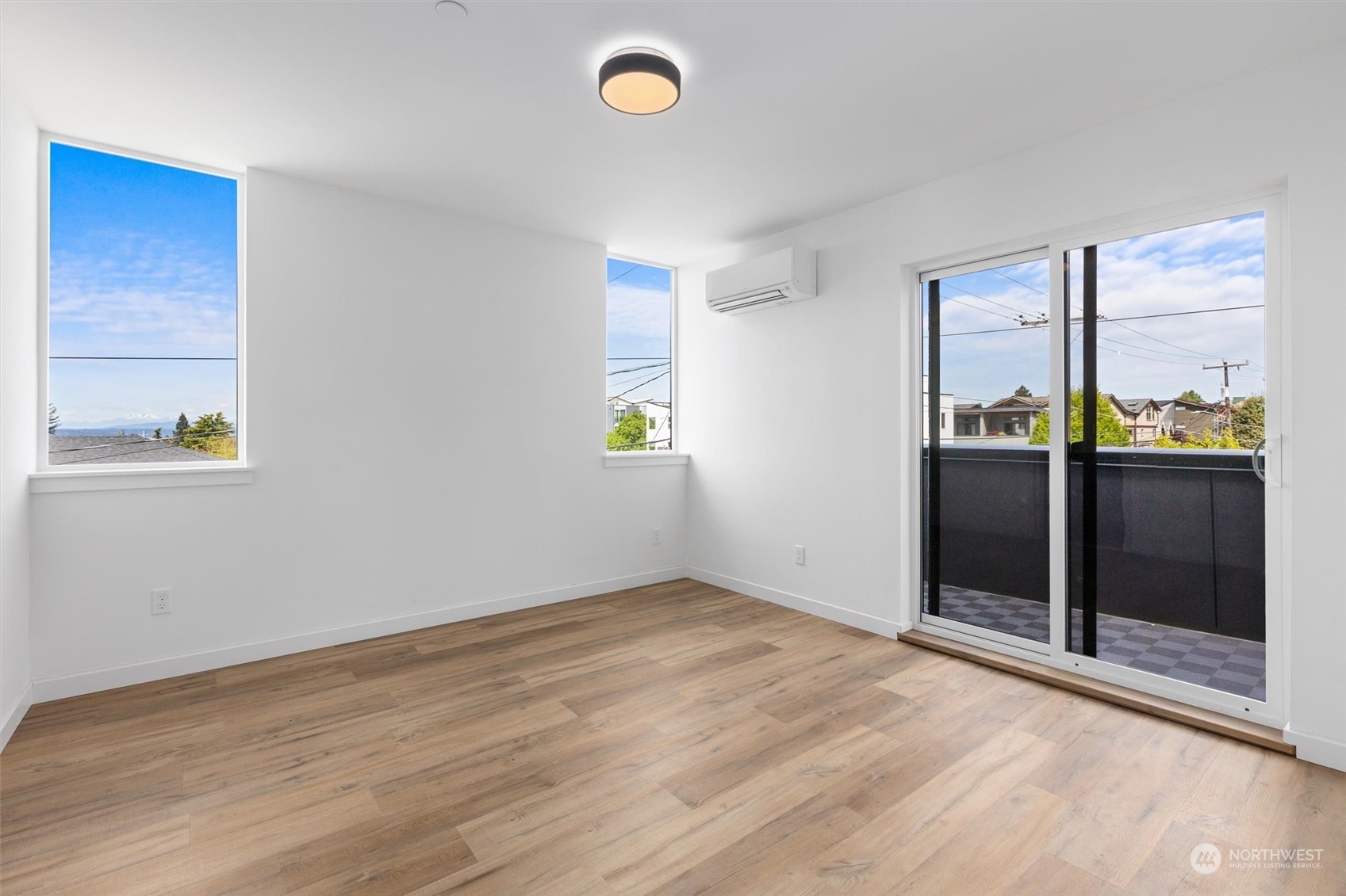 4211 Southwest Raymond Street Seattle, WA 98136 - Photo 12 of 27 an empty room with windows