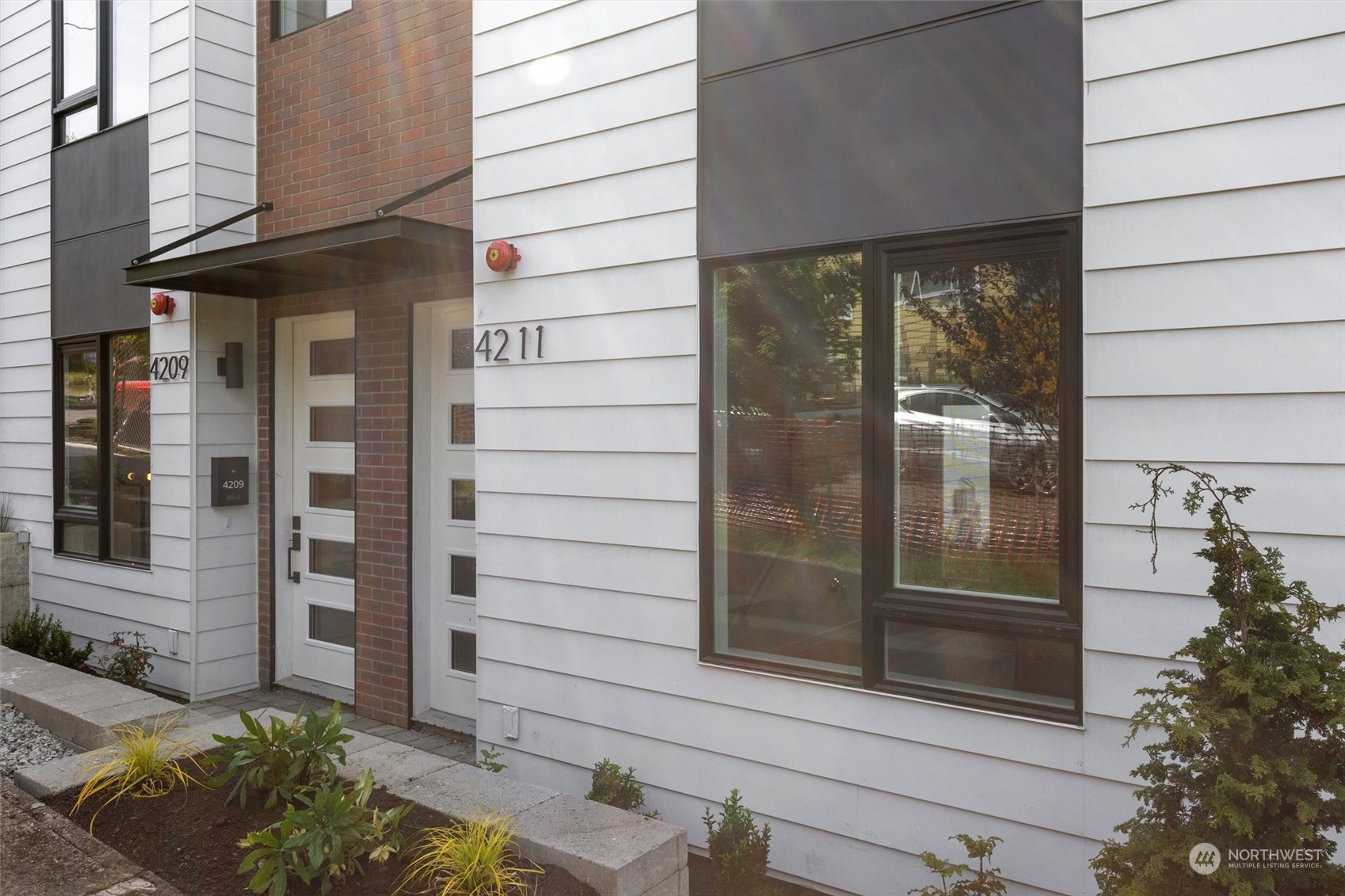 4211 Southwest Raymond Street Seattle, WA 98136 - Photo 2 of 27 a view of a door of the house