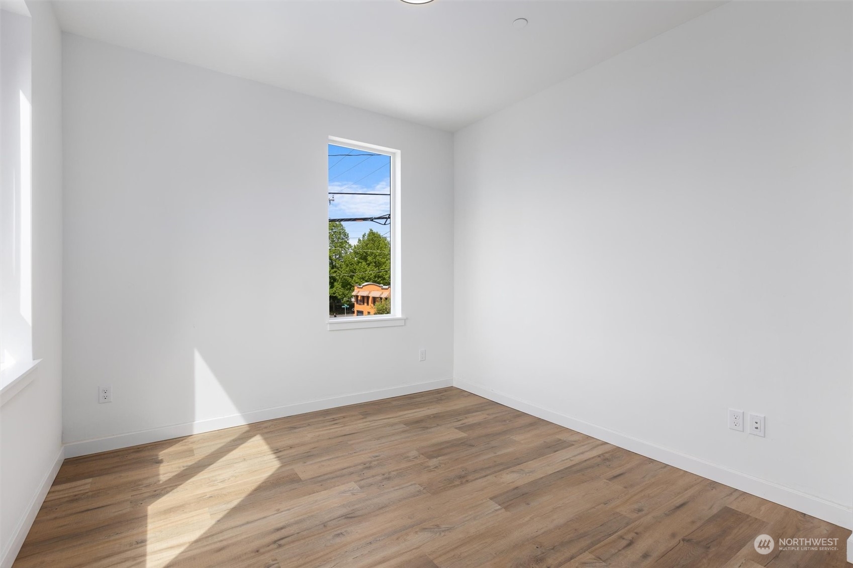 4211 Southwest Raymond Street Seattle, WA 98136 - Photo 7 of 27 an empty room with a window