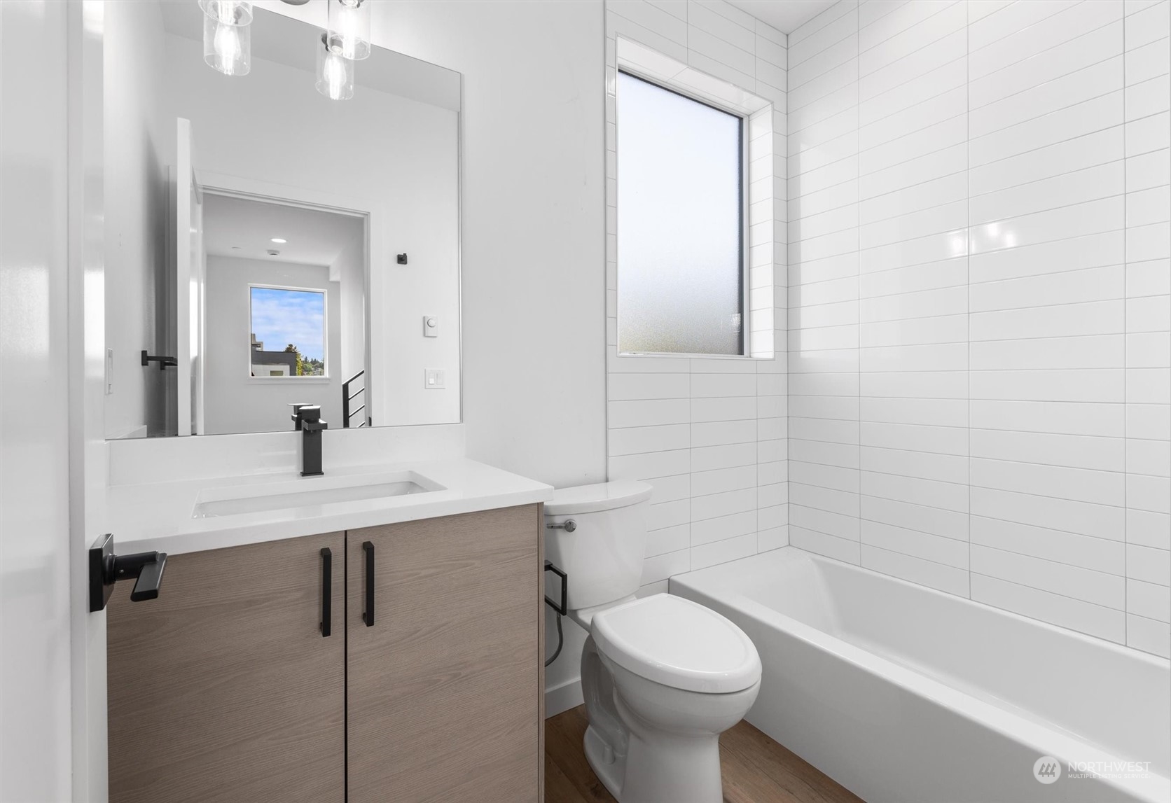 4211 Southwest Raymond Street Seattle, WA 98136 - Photo 8 of 27 a bathroom with a sink a toilet and shower