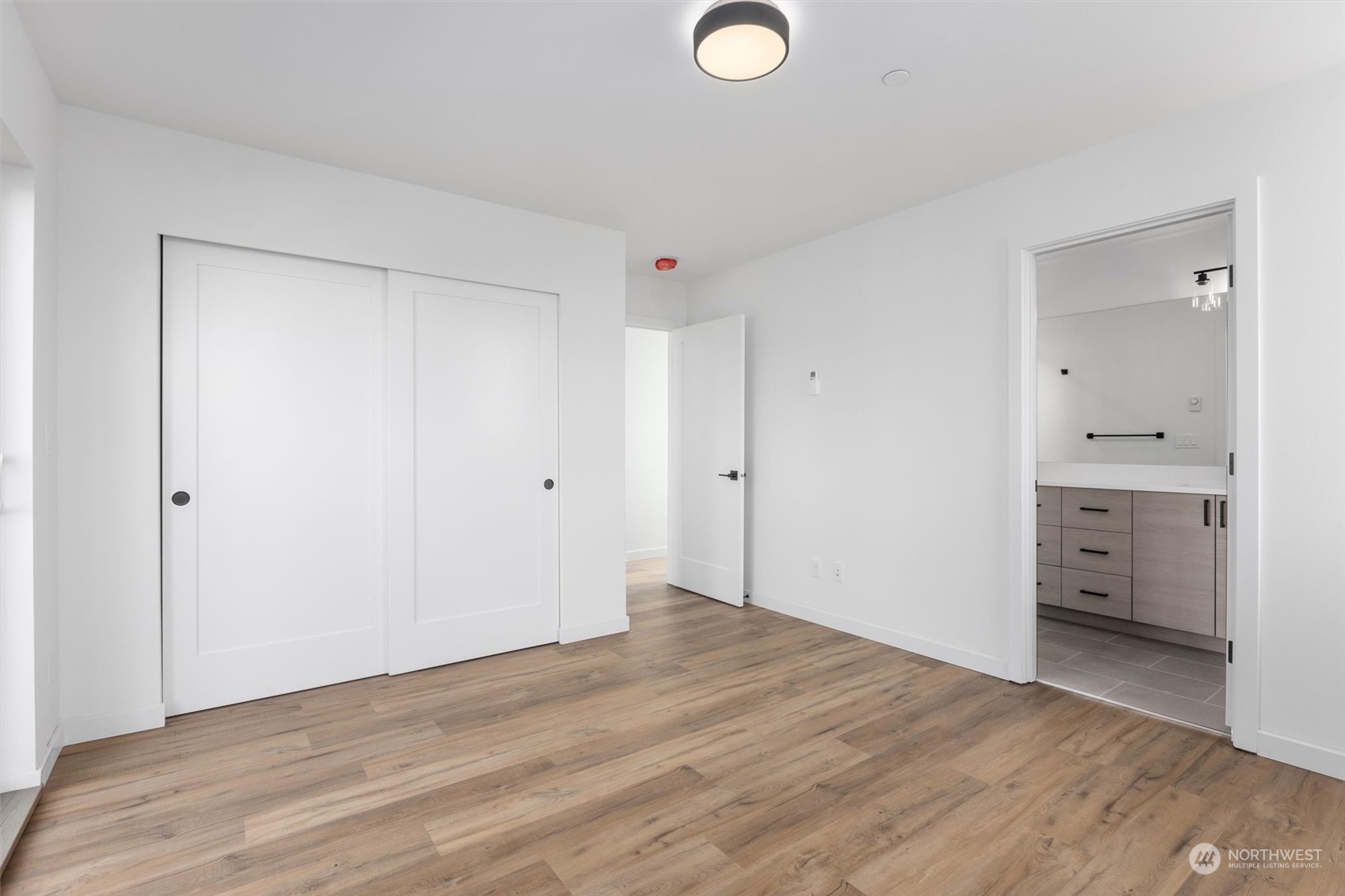 4211 Southwest Raymond Street Seattle, WA 98136 - Photo 9 of 27 wooden floor in an empty room