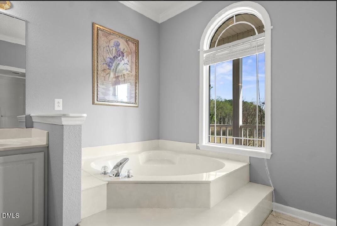 5780 McArthur Road Broadway, NC 27505 - Photo 25 of 40 a white bath tub sitting next to a window