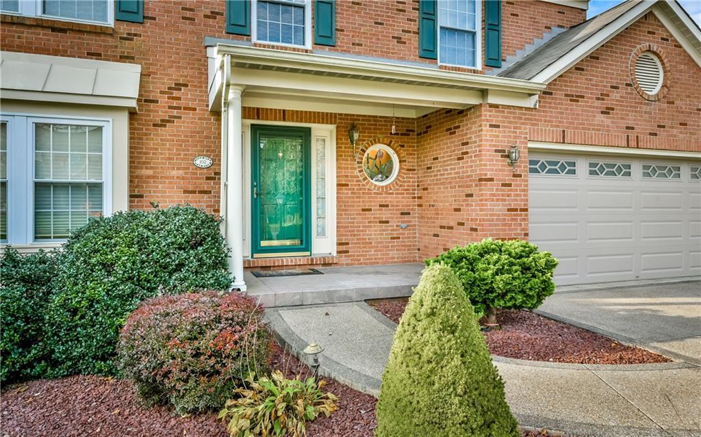 102 Ridgeview Circle Glenshaw, PA 15116 - Photo 2 of 25 Talk about curb appeal!! look at the beautiful landscaping, front porch, exposed aggregate driveway and walkway, and new garage door!