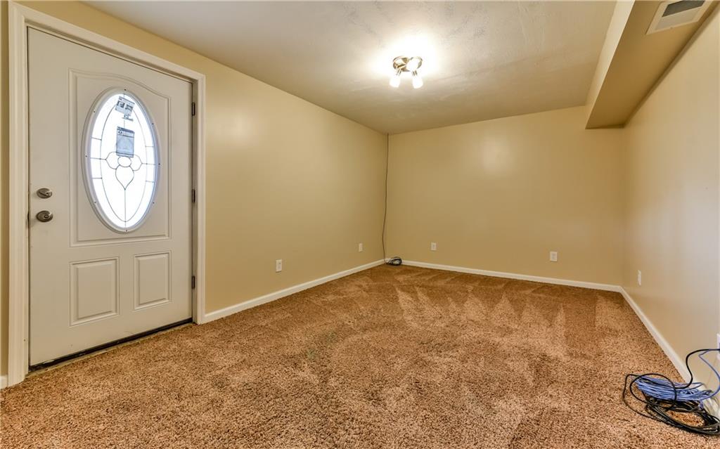 102 Ridgeview Circle Glenshaw, PA 15116 - Photo 20 of 25 Den/office on the lower level with a door leading to the rear yard