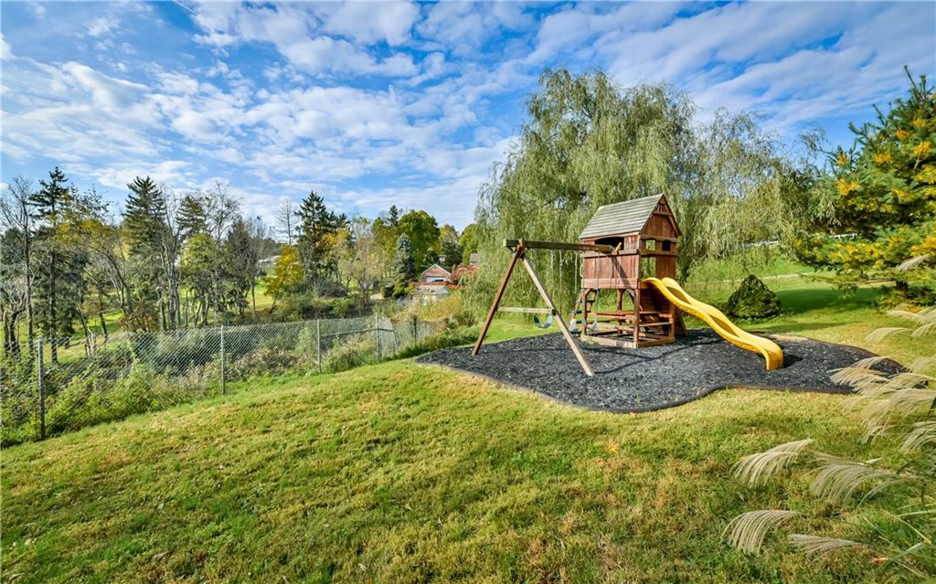 102 Ridgeview Circle Glenshaw, PA 15116 - Photo 22 of 25 The private lower yard includes this wonderful Playground World playset complete with rubberized mulch!