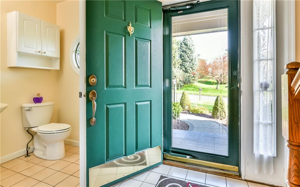 102 Ridgeview Circle Glenshaw, PA 15116 - Photo 4 of 25 Full view storm door looks out onto the peaceful street. there is a first floor powder room